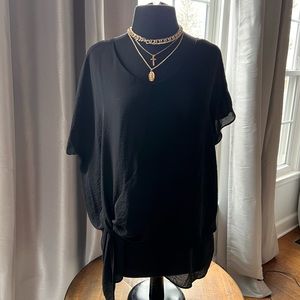 Black silky top with capped dolman sleeves.